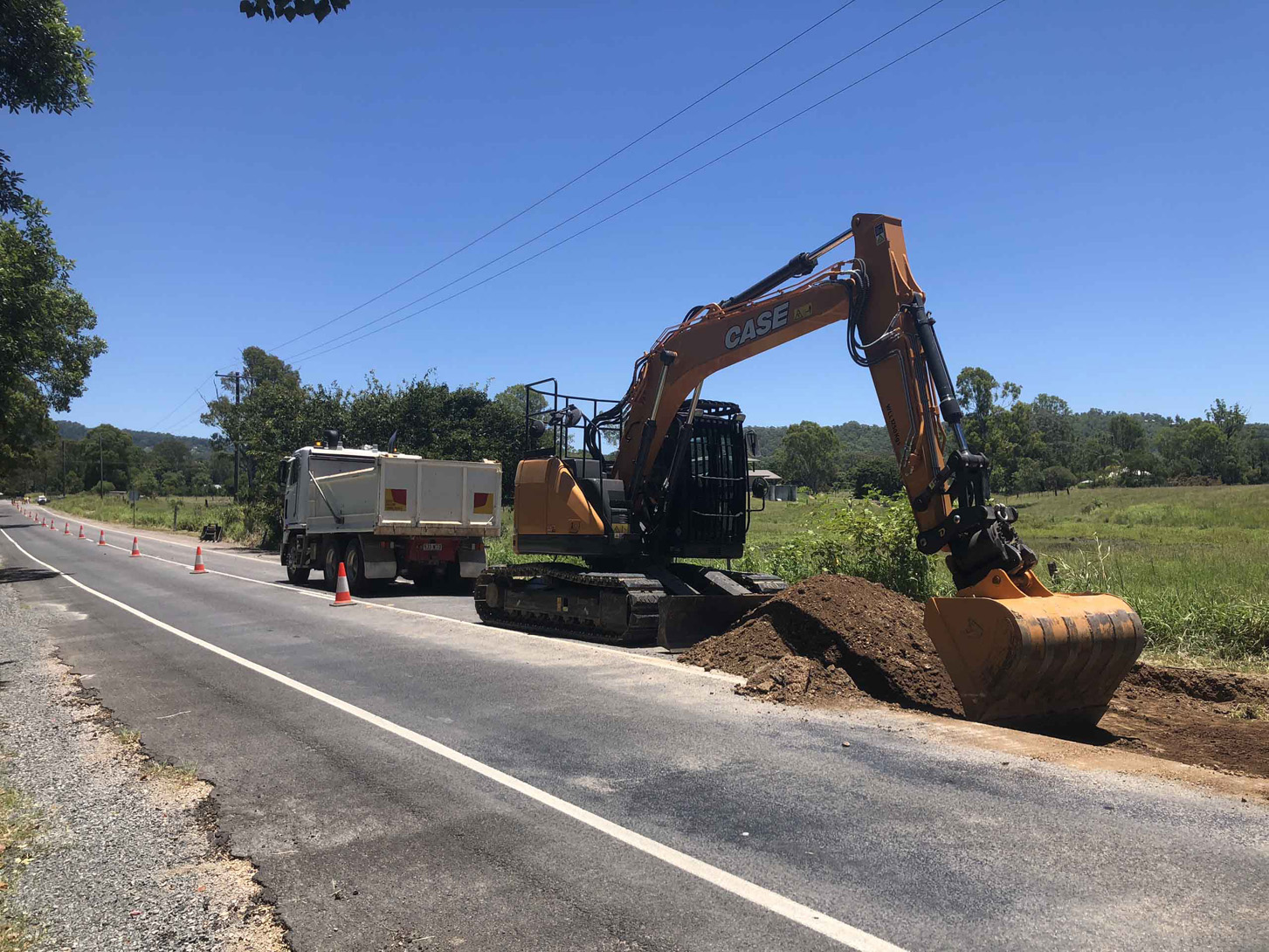 Excavator during road removal